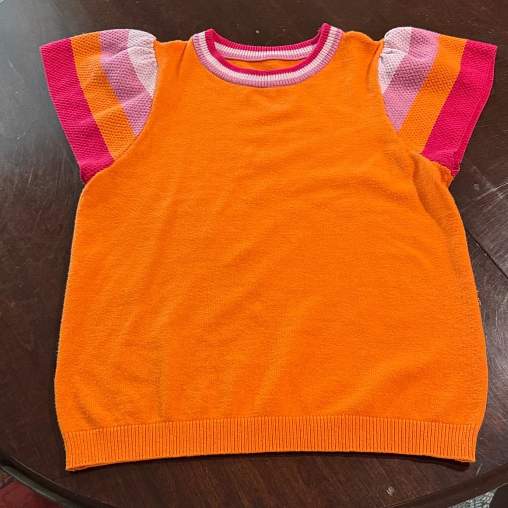 Orange sweater with pink accents